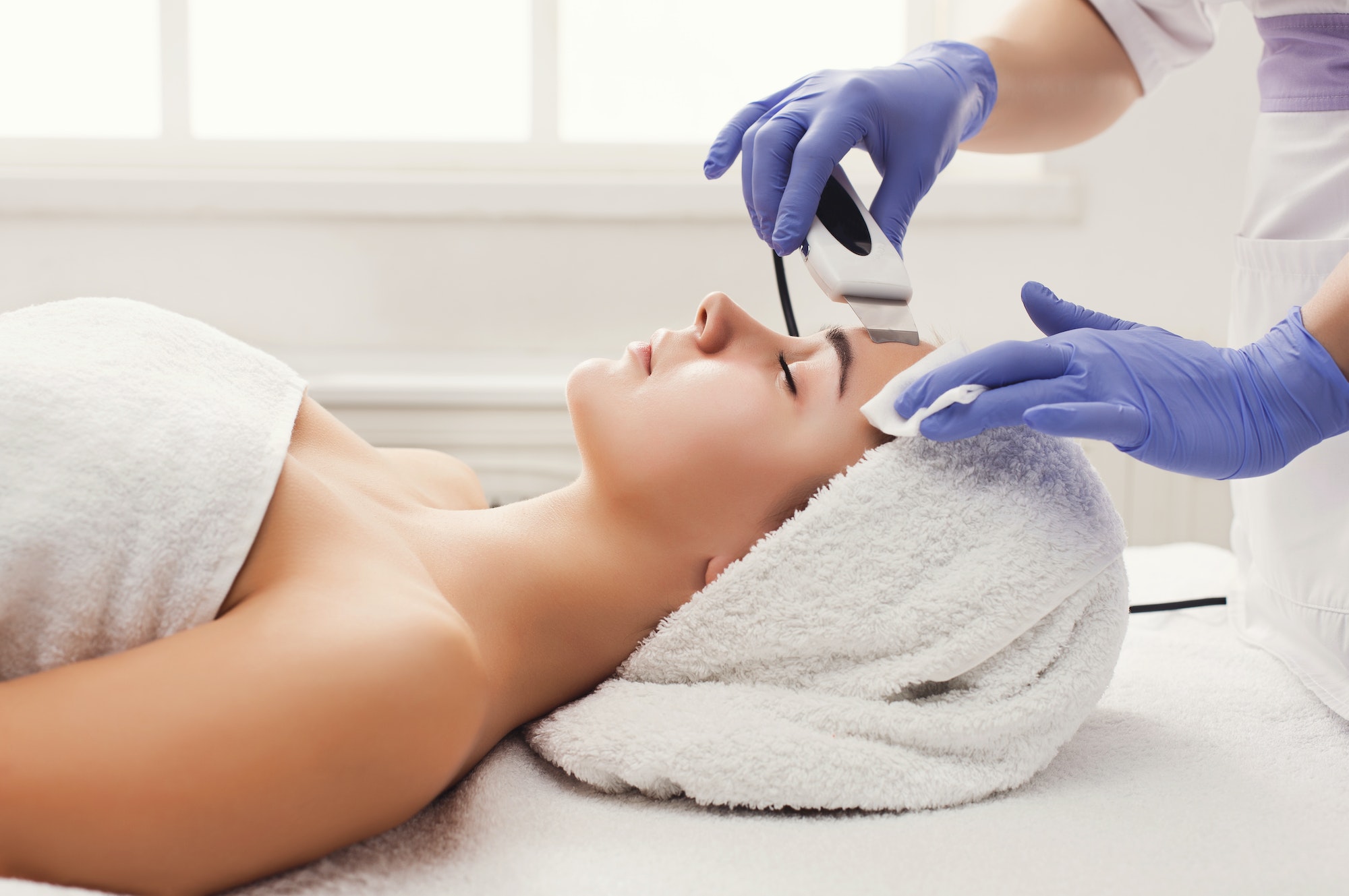 woman-getting-facial-treatment-at-beauty-salon.jpg